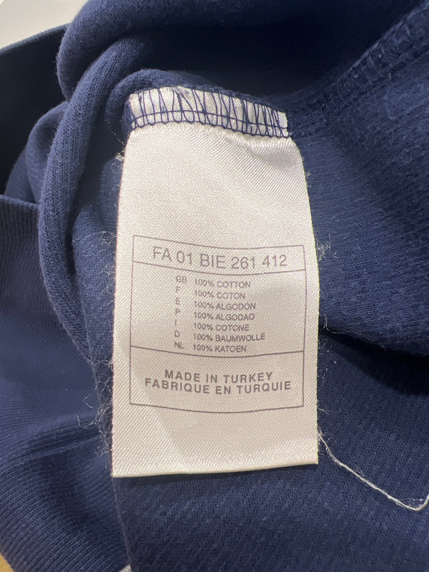 Fabric tag on a blue fabric background