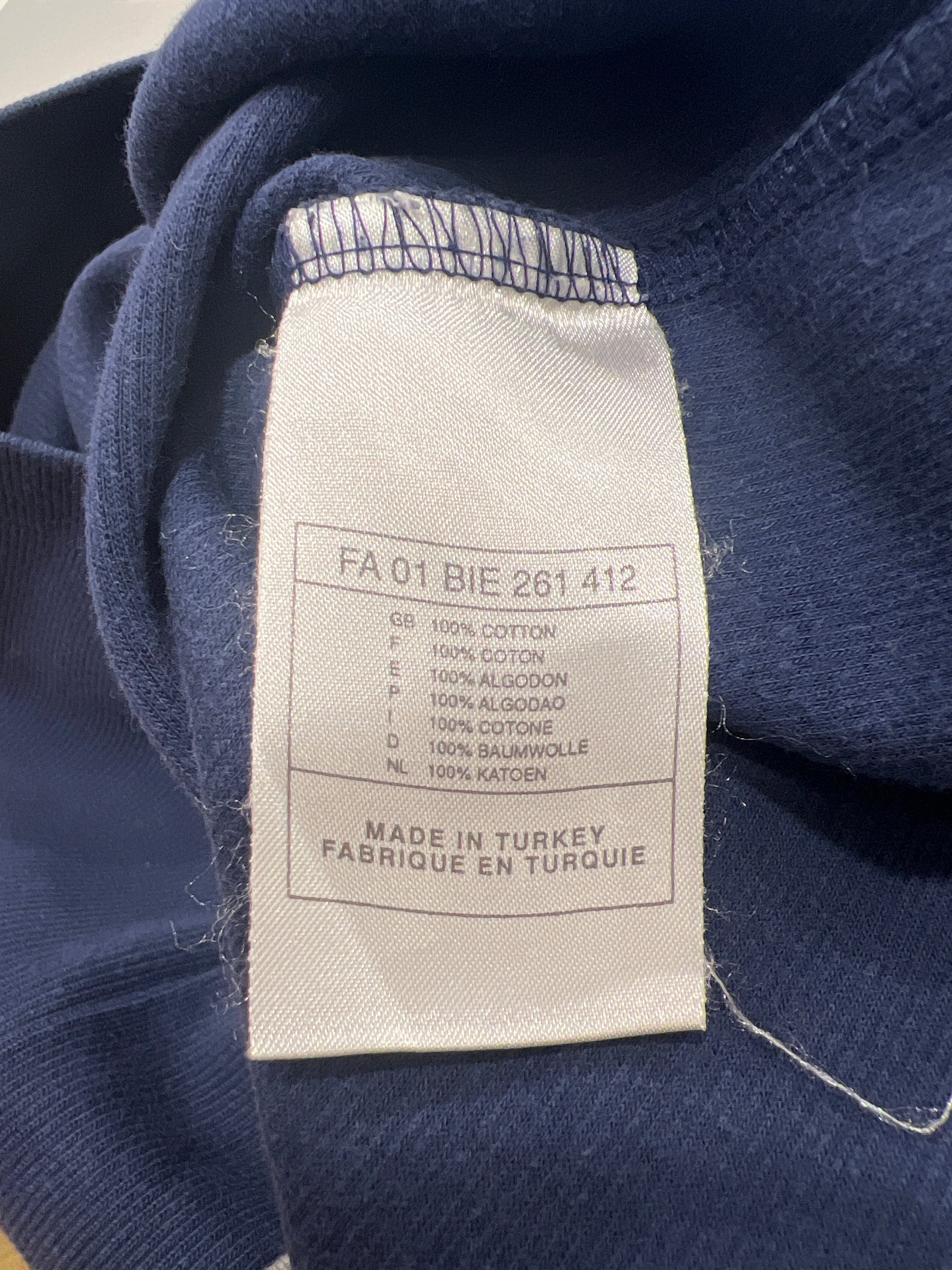 Fabric tag on a blue fabric background
