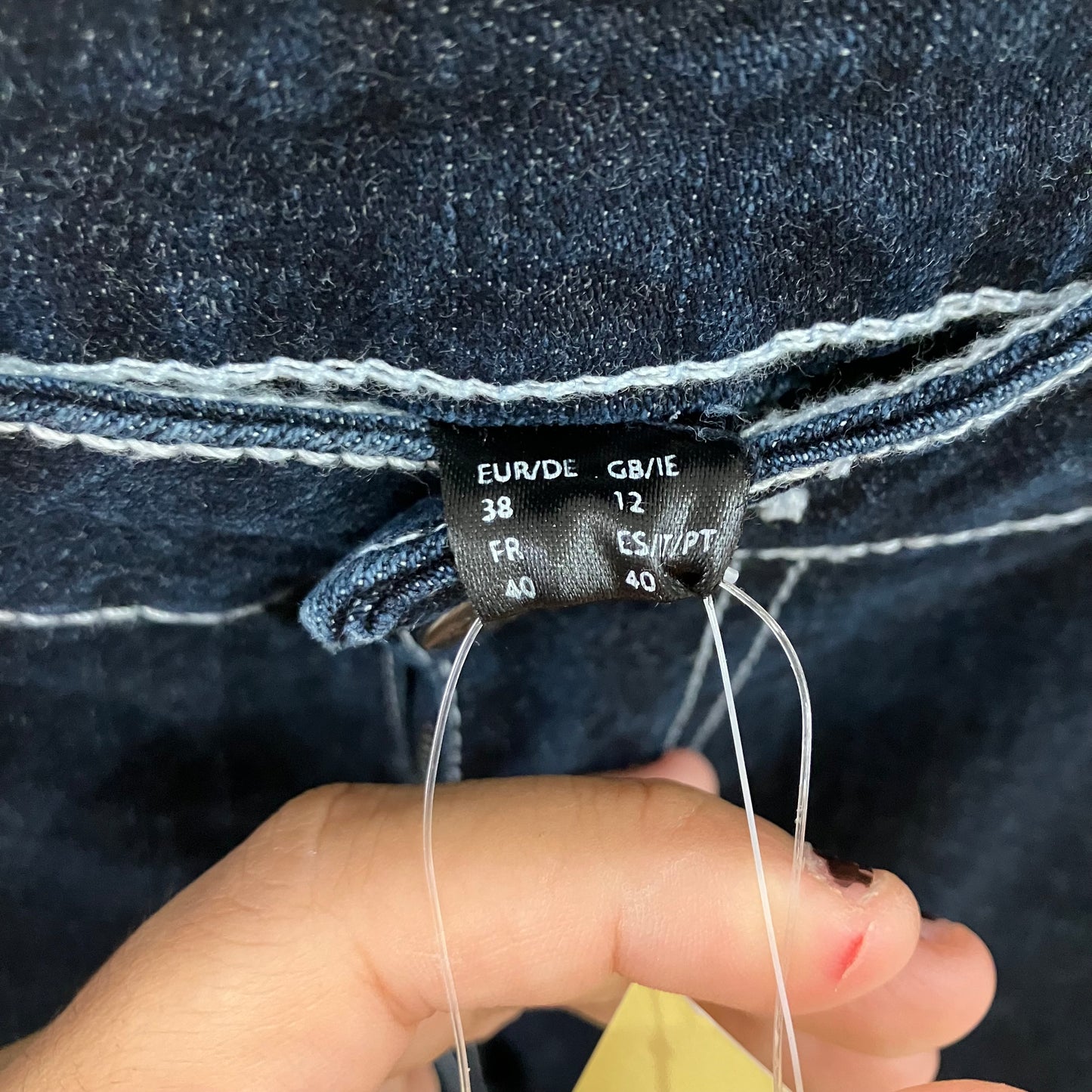 dark wash denim capris with white stitching