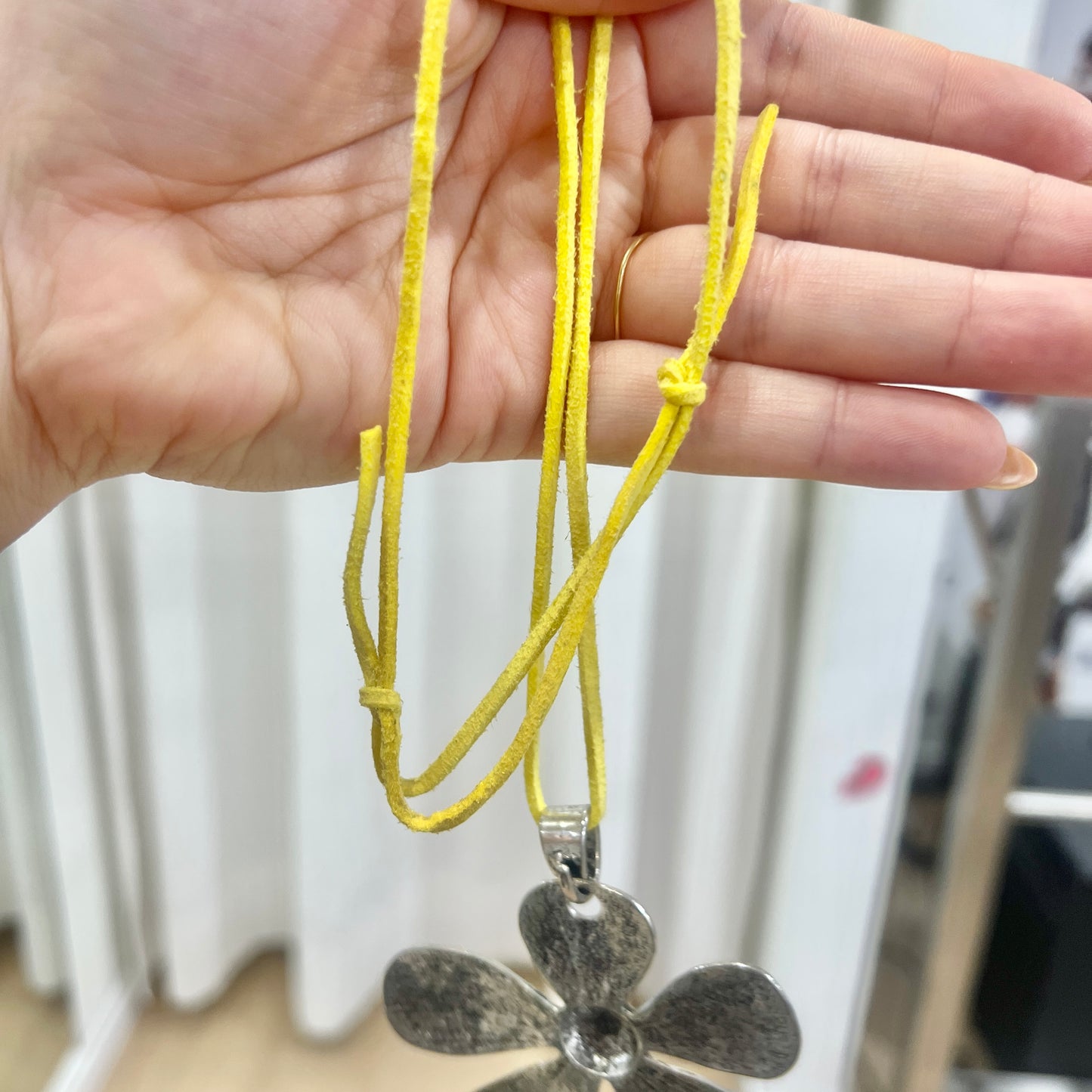 silver metal maxi flower pendant necklace with yellow adjustable faux suede string