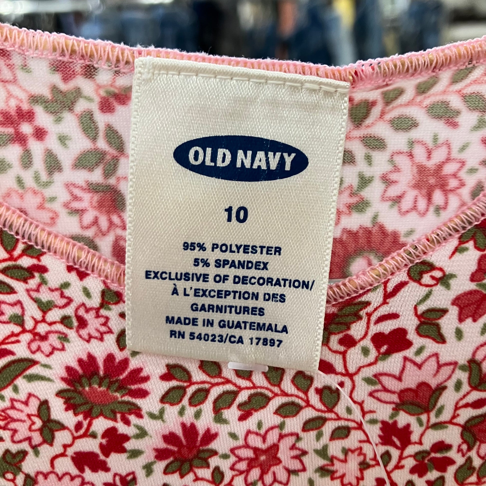 Old Navy label on a floral-patterned garment with pink trim