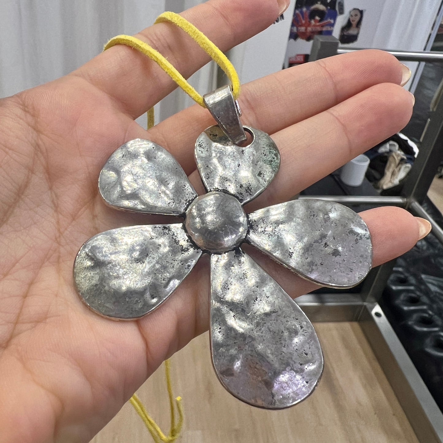 silver metal maxi flower pendant necklace with yellow adjustable faux suede string