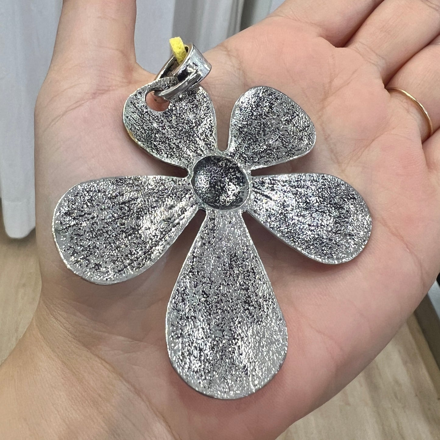 silver metal maxi flower pendant necklace with yellow adjustable faux suede string
