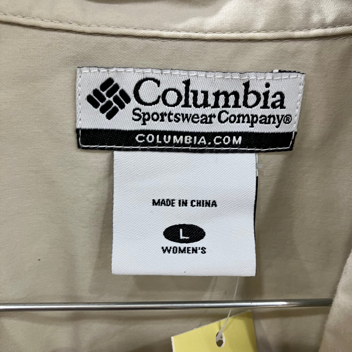 Columbia Sportswear Company label on a beige jacket with a white tag