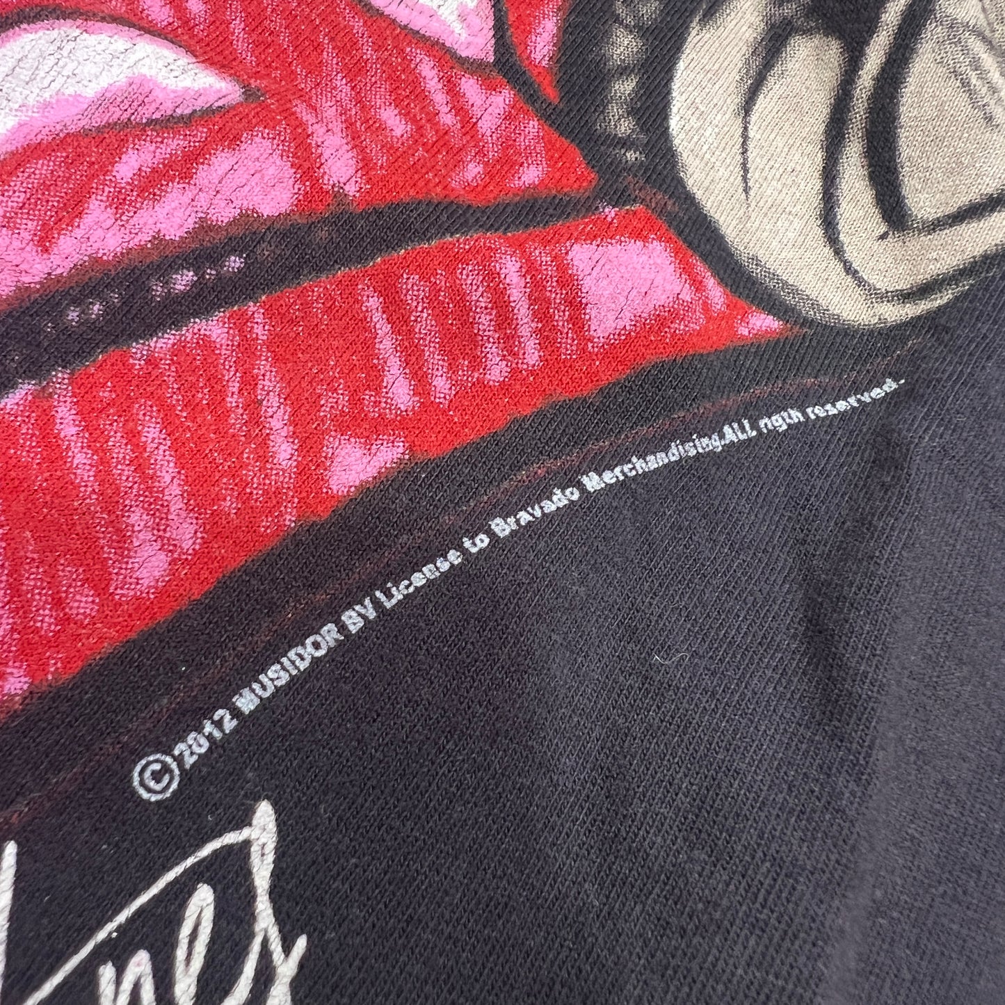 rolling stones 2012 black tshirt with tongue wearing headphones