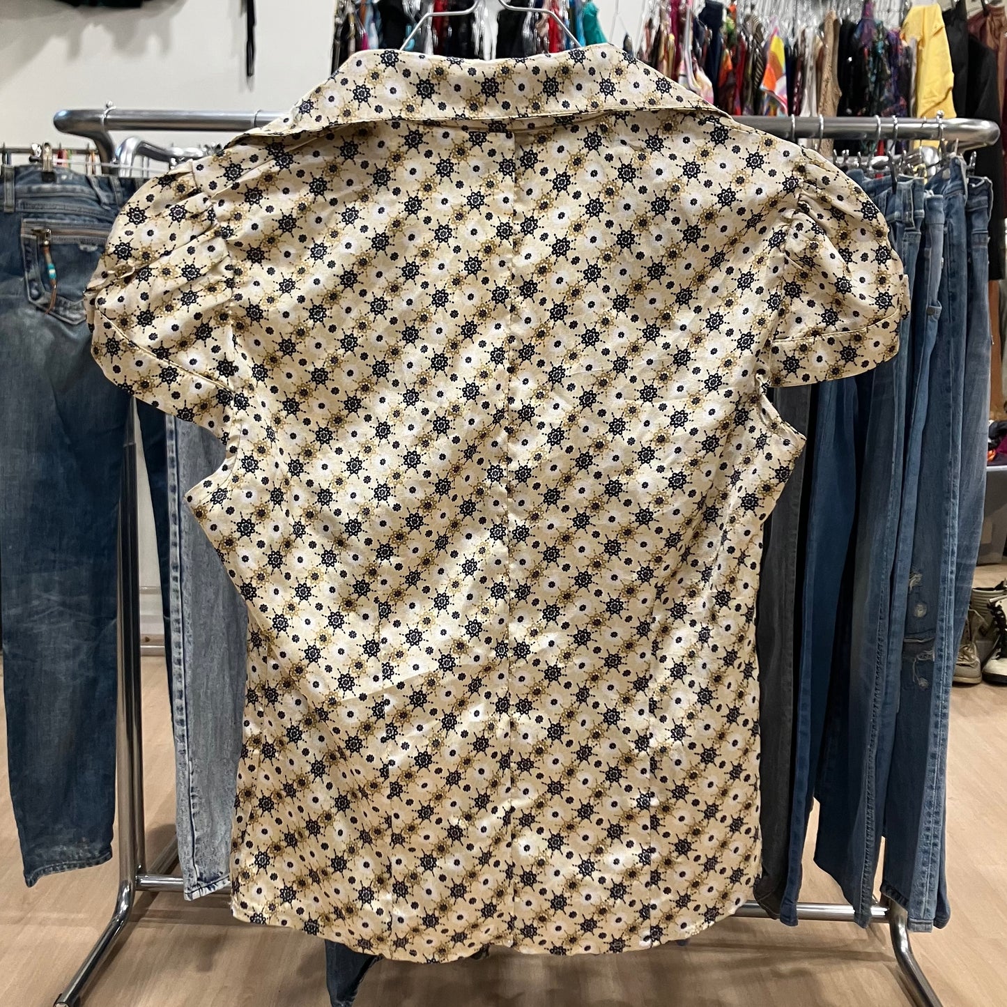 gold shiny short sleeve shirt with black geometric print