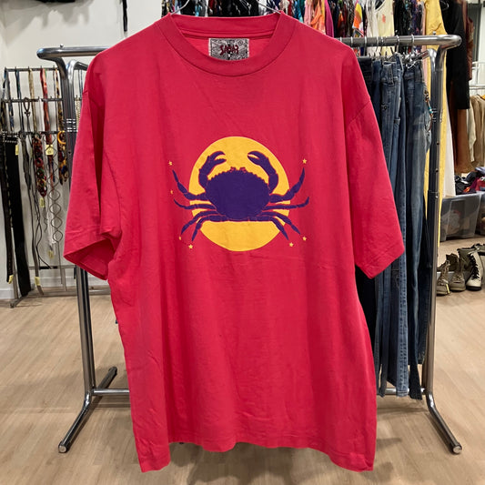 Red t-shirt with a purple crab design on a clothing rack