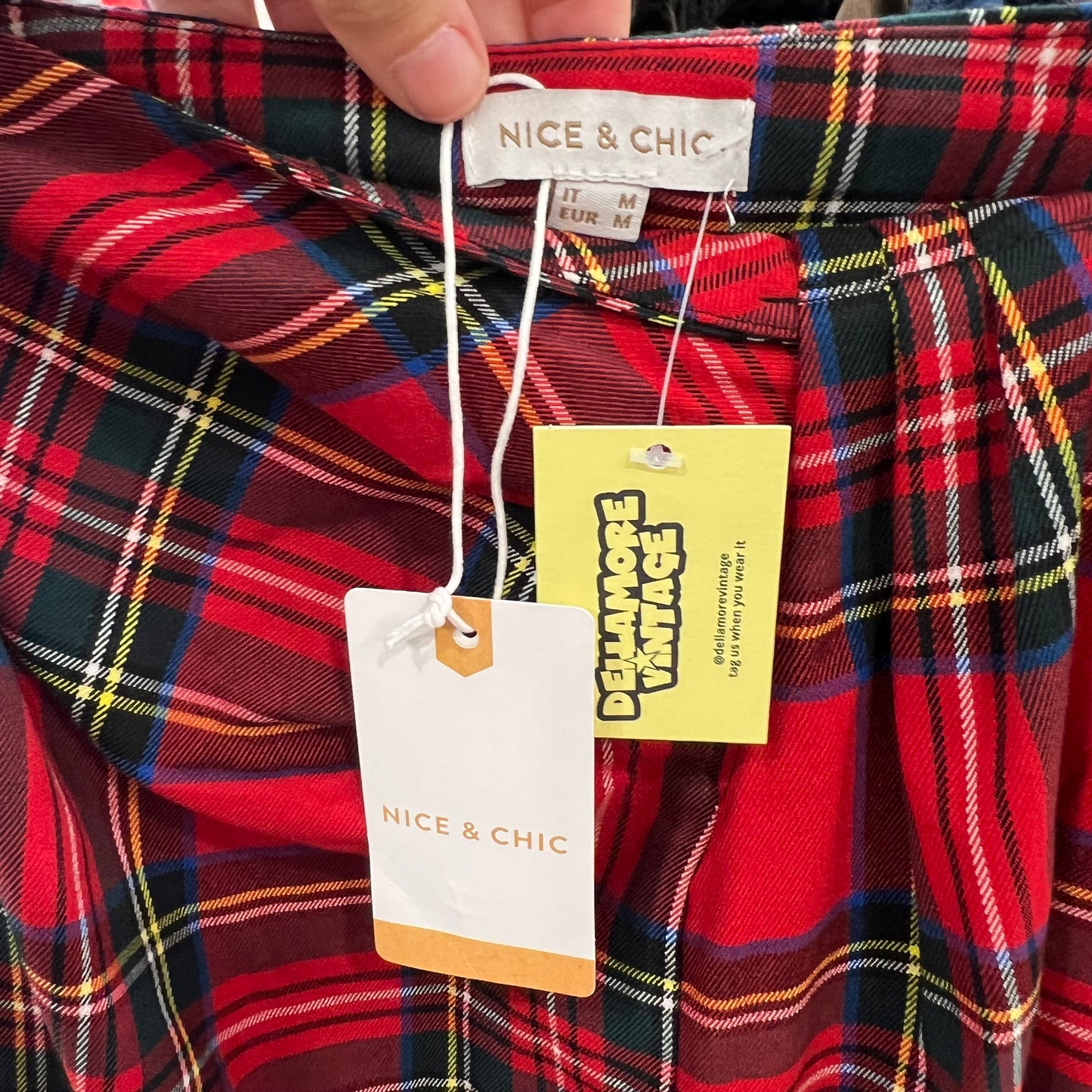 Red plaid shirt with 'Nice & Chic' and 'Delamore Vintage' tags