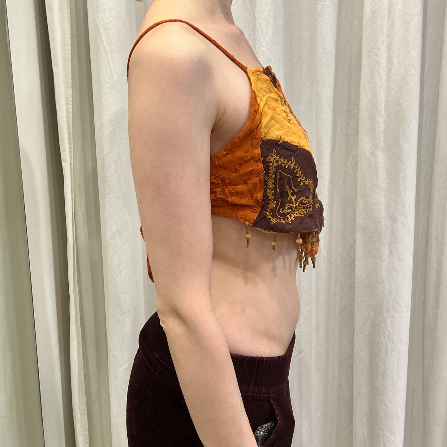 savage culture 00s brown orange patchwork triangle crop top with beaded fringes