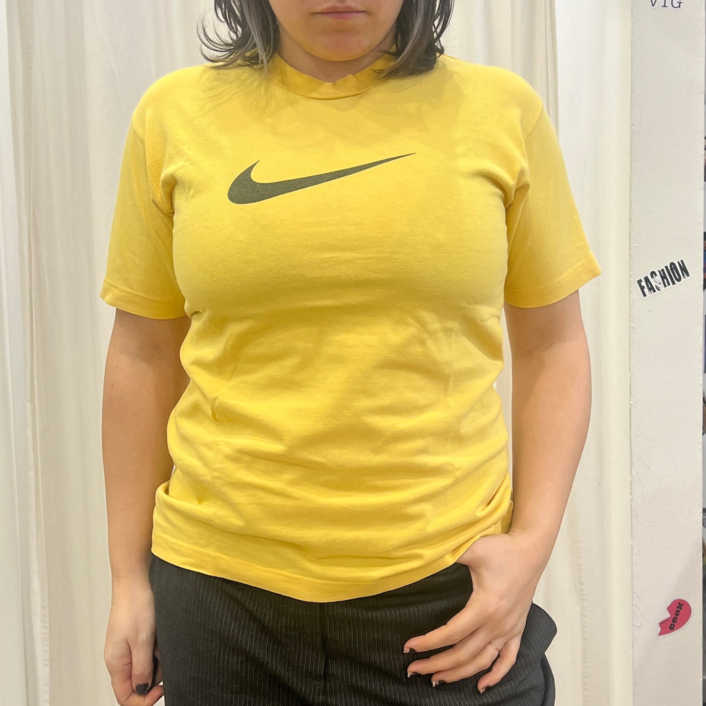nike 00s yellow tshirt with black swoosh logo