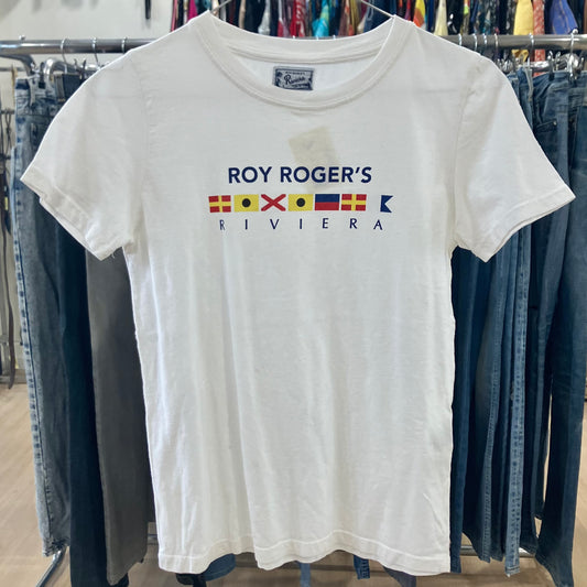White t-shirt with 'Roy Roger's Riviera' logo on a rack with jeans