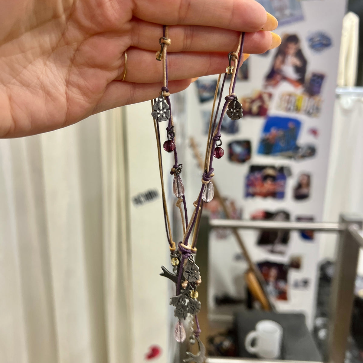 boho whimsy string necklace with silver floral and swallow pendants