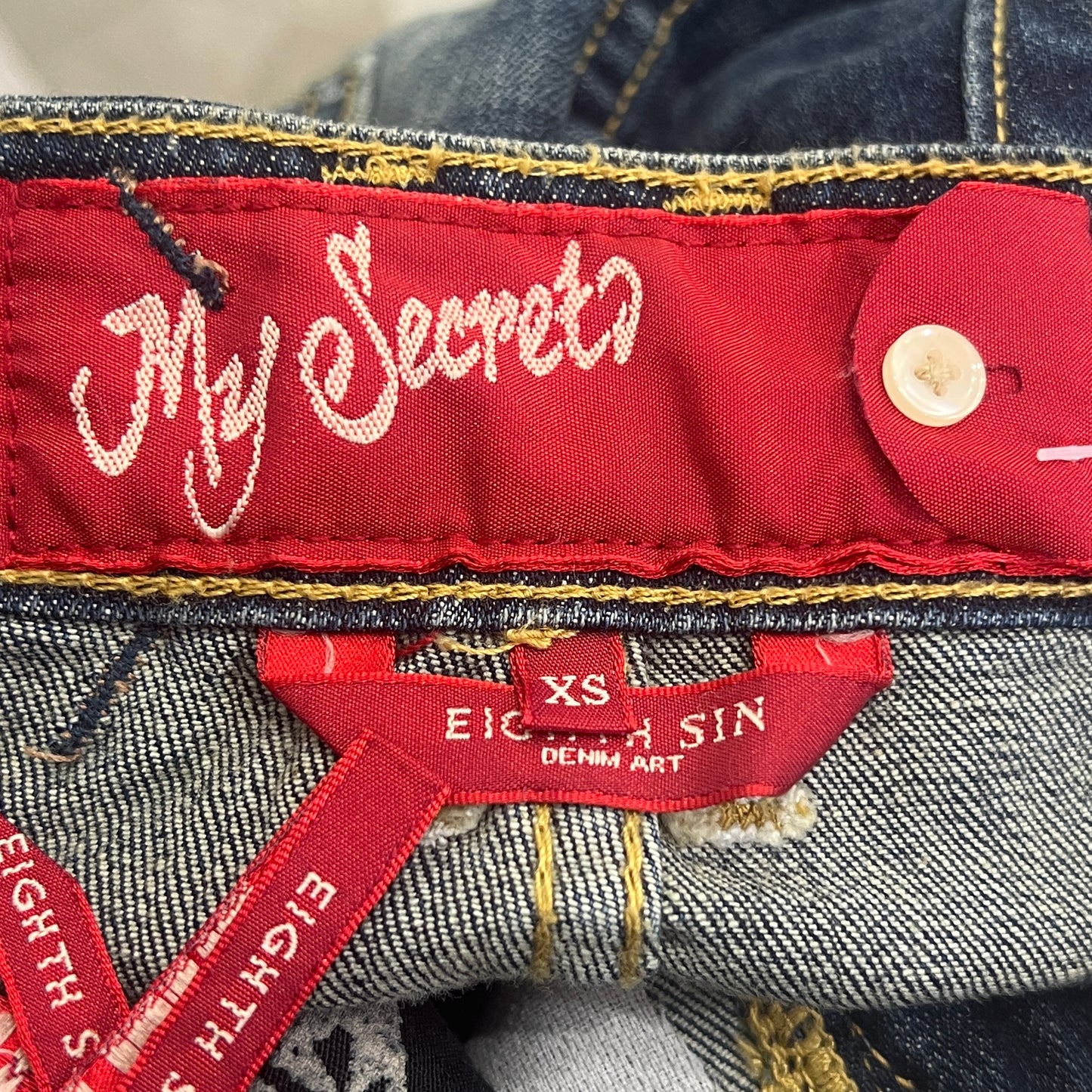 eighth sin 00s distressed dark wash mini skirt with pearls and secret inside pocket