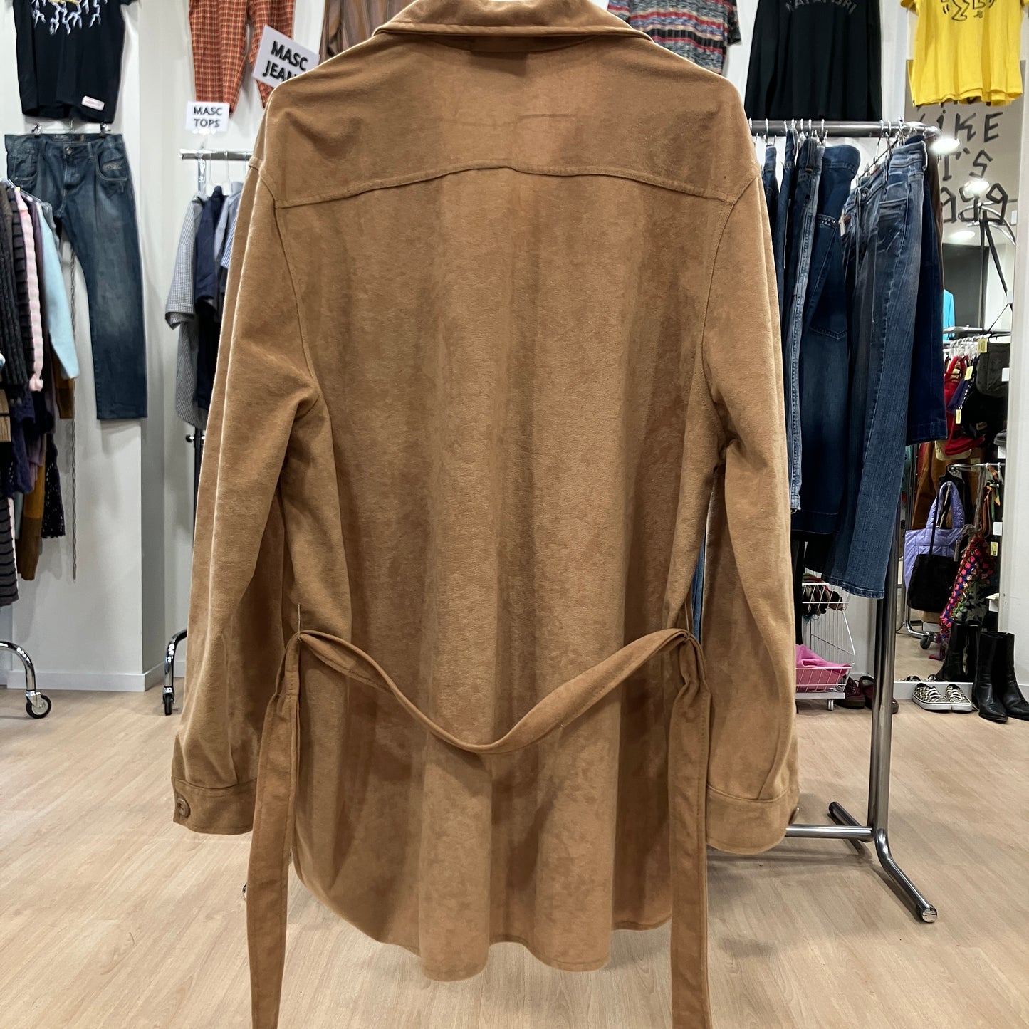 Brown shirt on a hanger in a clothing store