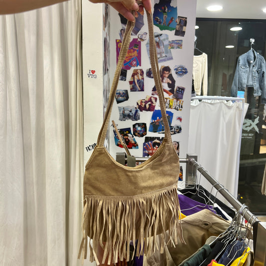 beige suede shoulder bag with fringes