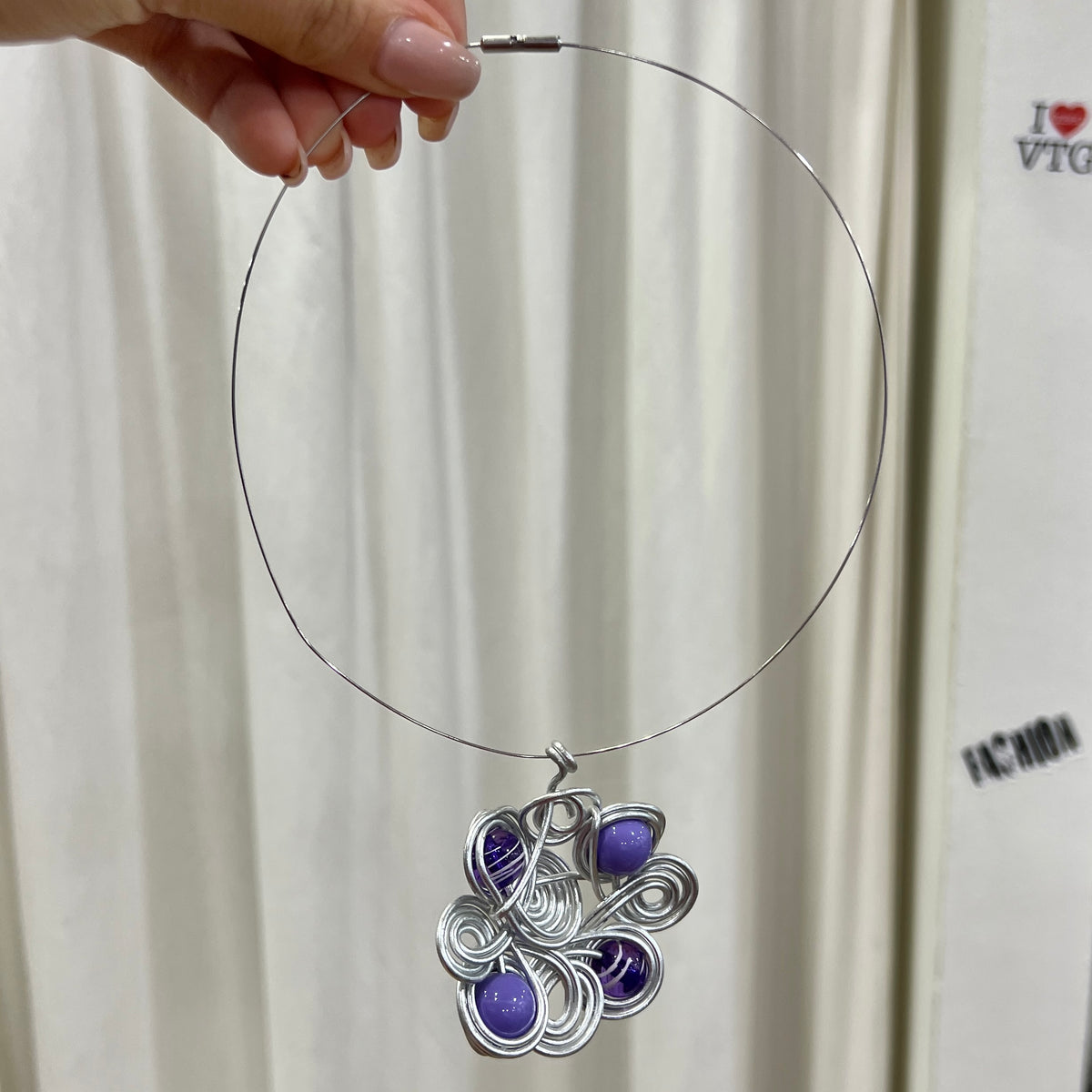 silver wire choker with swirly wire floral pendant with purple beads