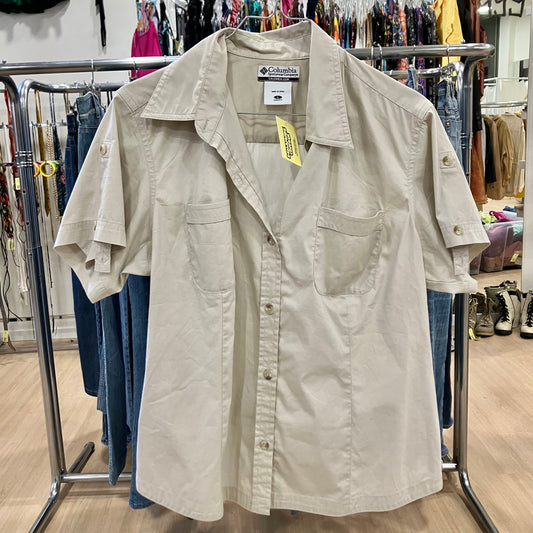 Beige shirt with Columbia label on a rack in a store