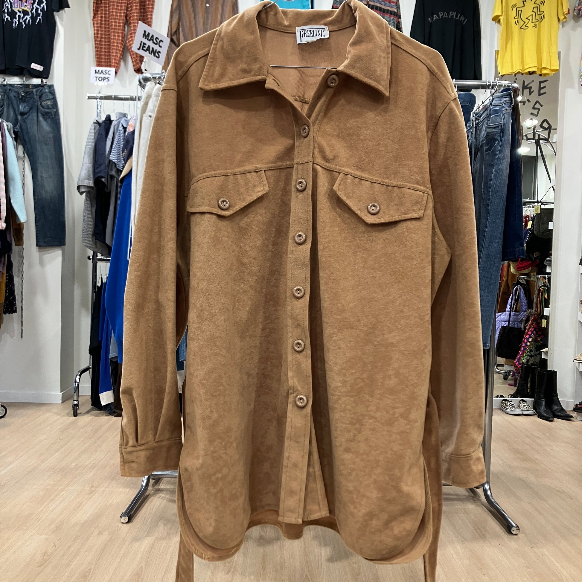 Brown shirt in a clothing store setting