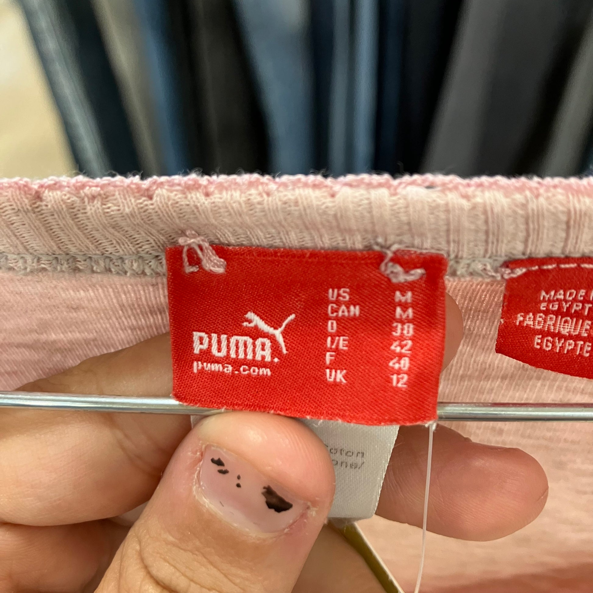 Puma tag on a garment with size chart