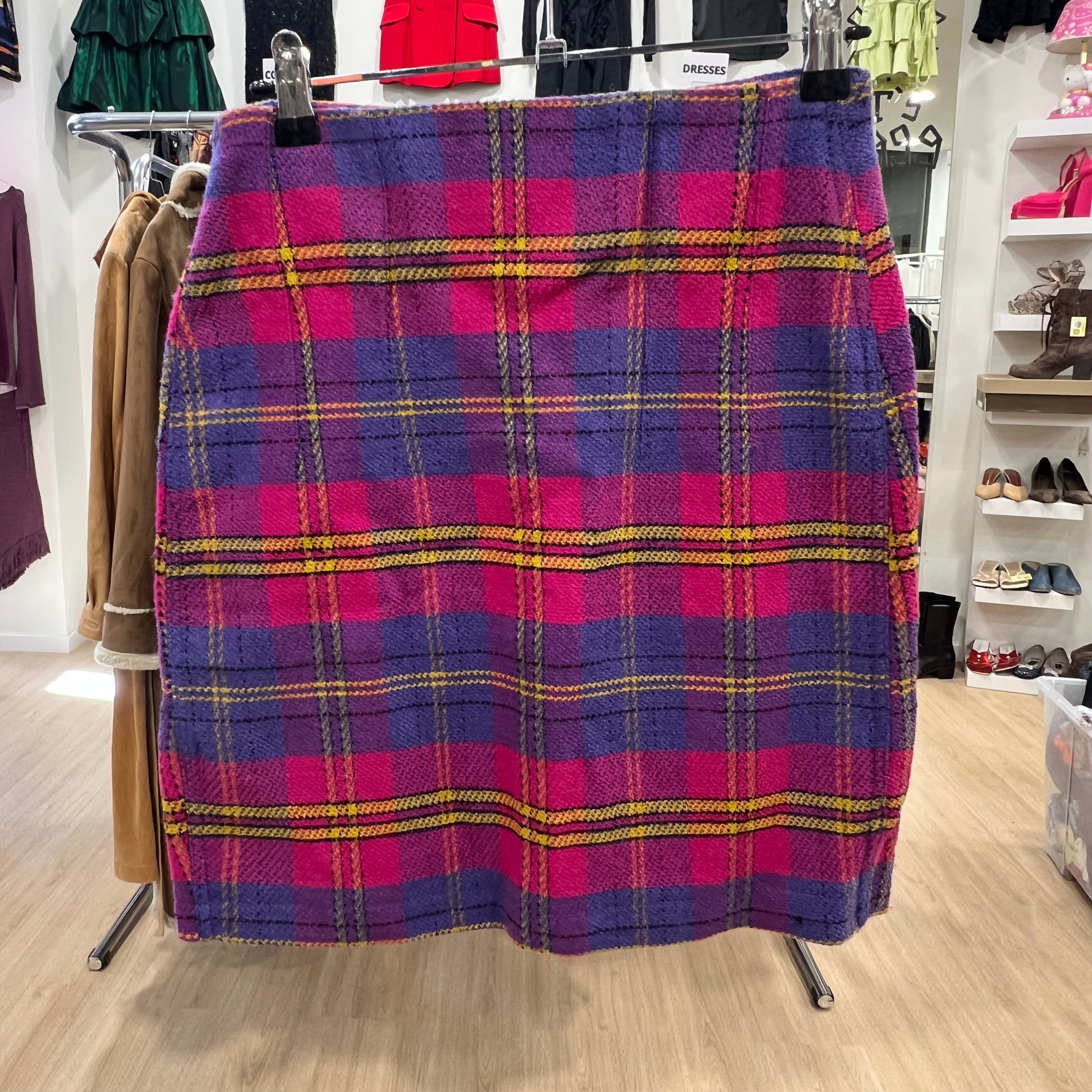 Plaid skirt on a rack in a store setting