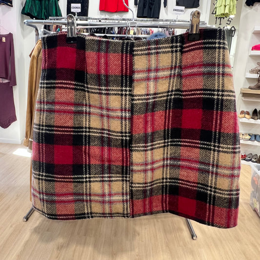 Plaid skirt on a rack in a store setting