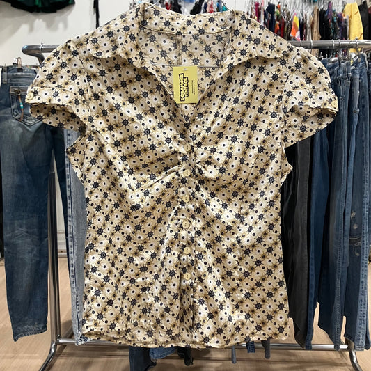 gold shiny short sleeve shirt with black geometric print