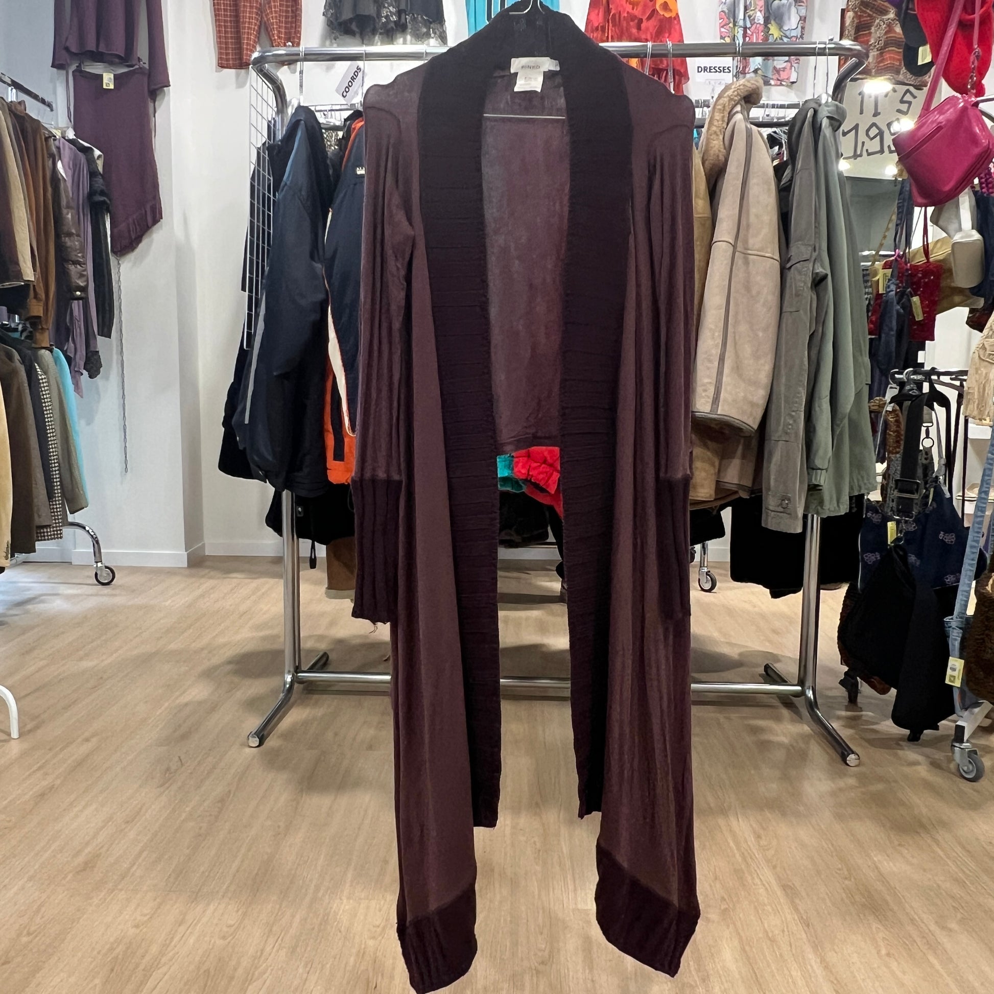 Brown cardigan on a rack in a clothing store