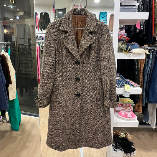 Brown textured coat in a clothing store