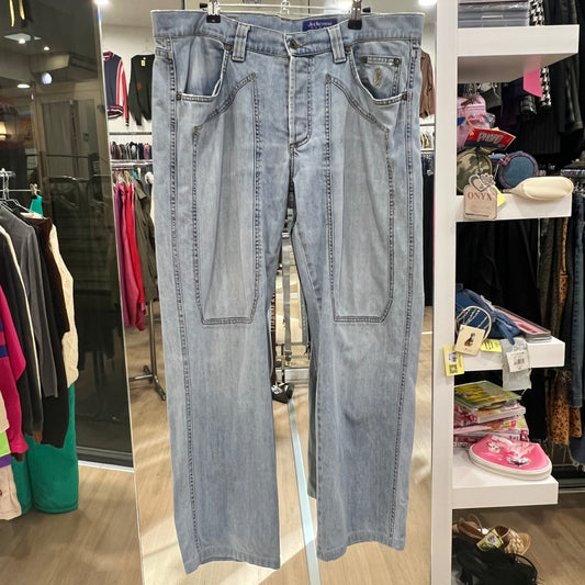 Light blue jeans hanging in a store with various clothing items in the background
