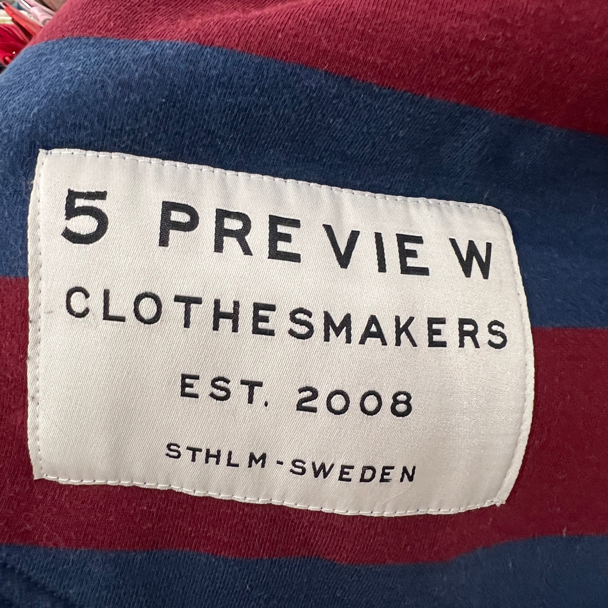 Clothes label on a garment with '5 PREVIE W CLOTHESMAKERS' branding