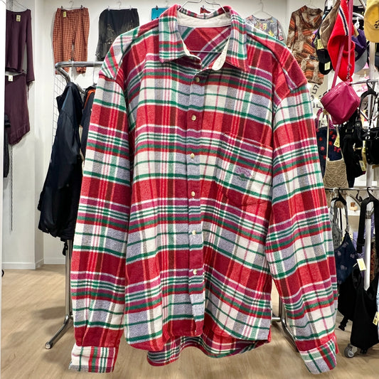 Plaid shirt on a rack with a store setting in the background