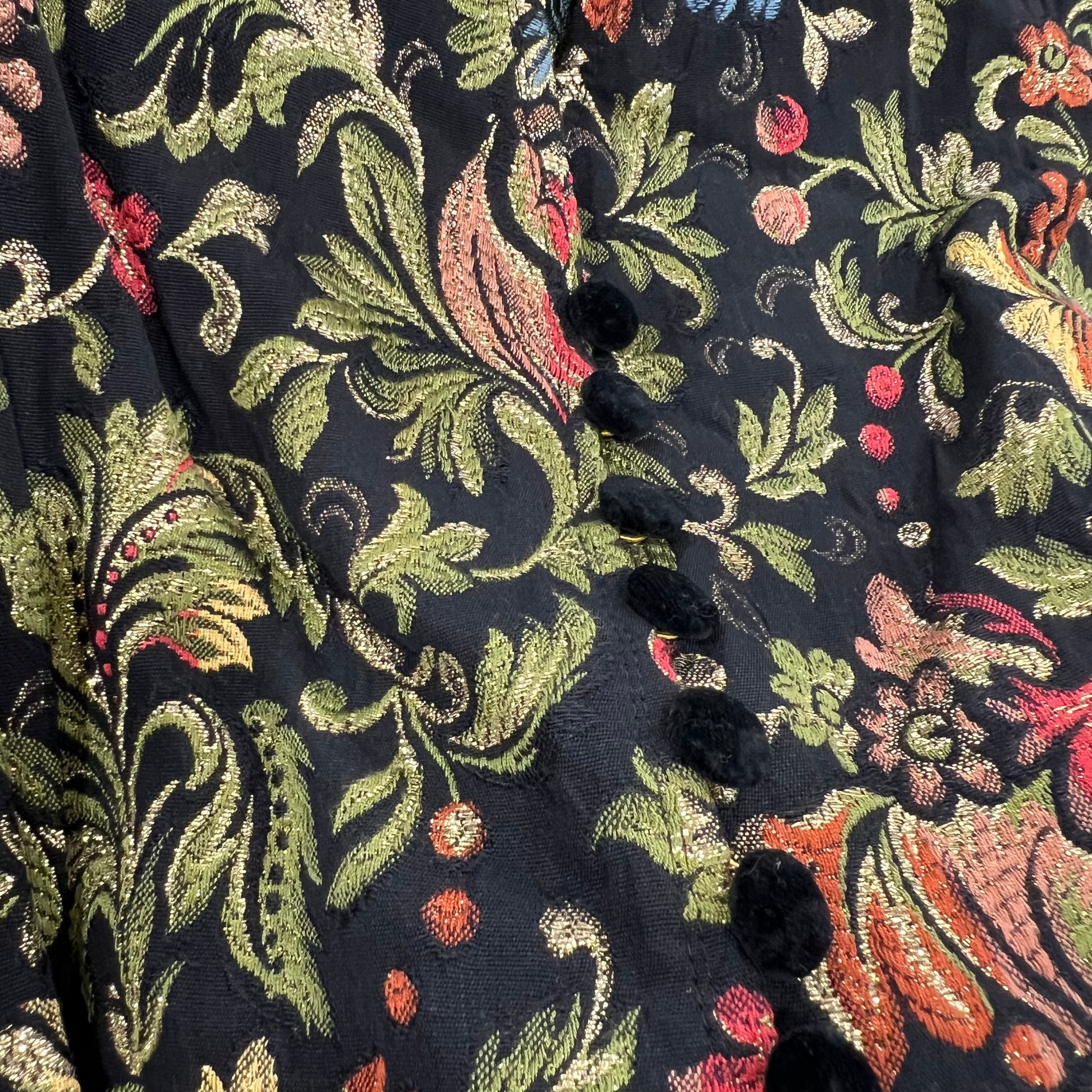 Close-up of a floral embroidered fabric with black background