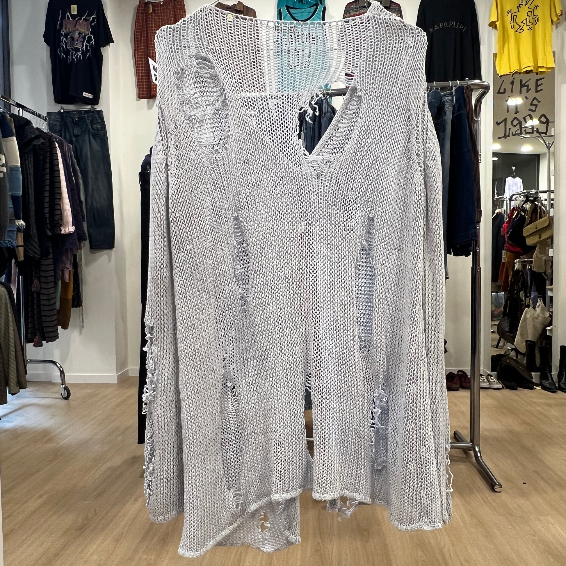 Silver sequin dress on a hanger in a clothing store