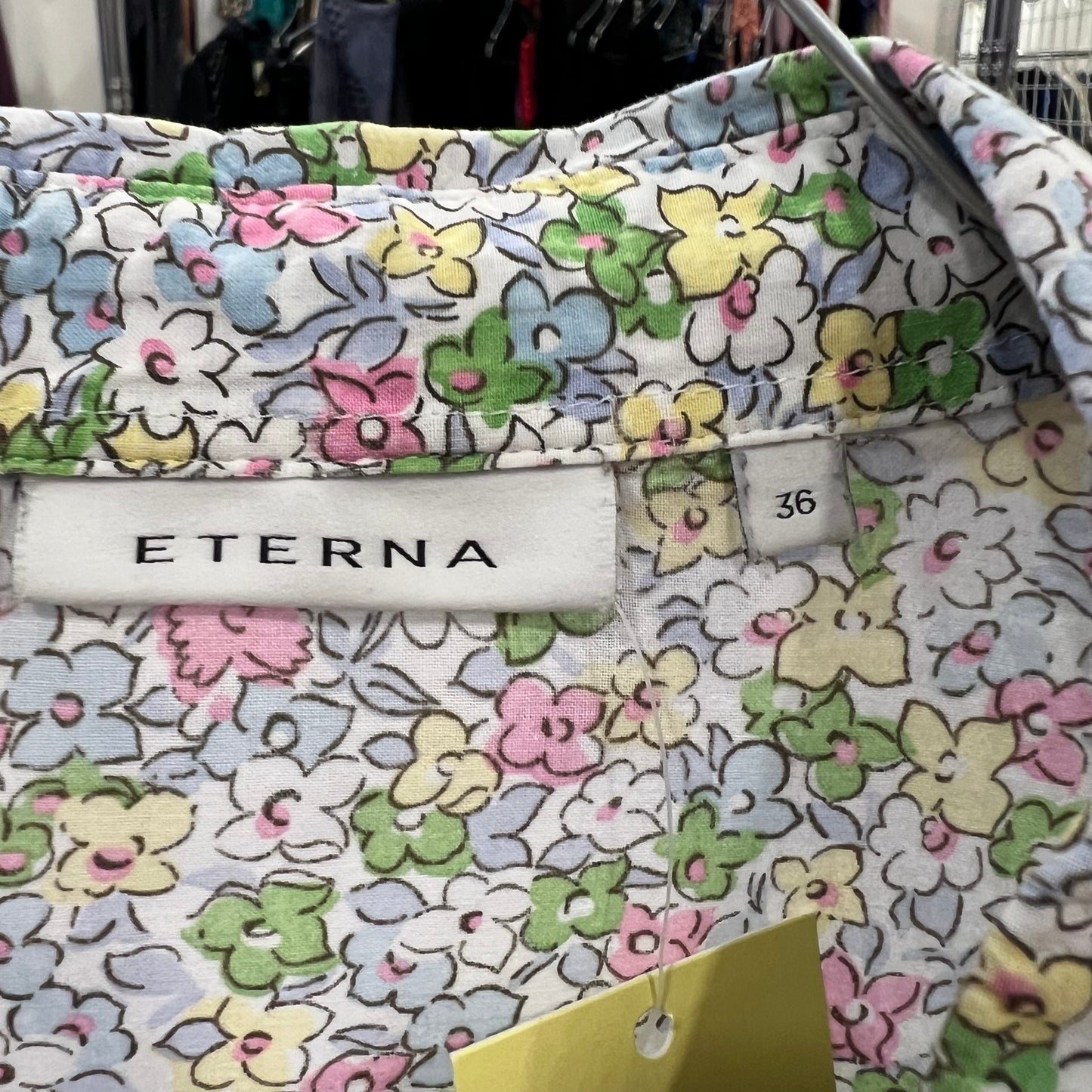 Floral-patterned fabric with 'ETERNA' label and size tag