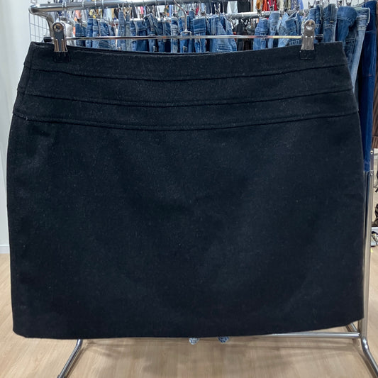 Black skirt on a rack with jeans in the background