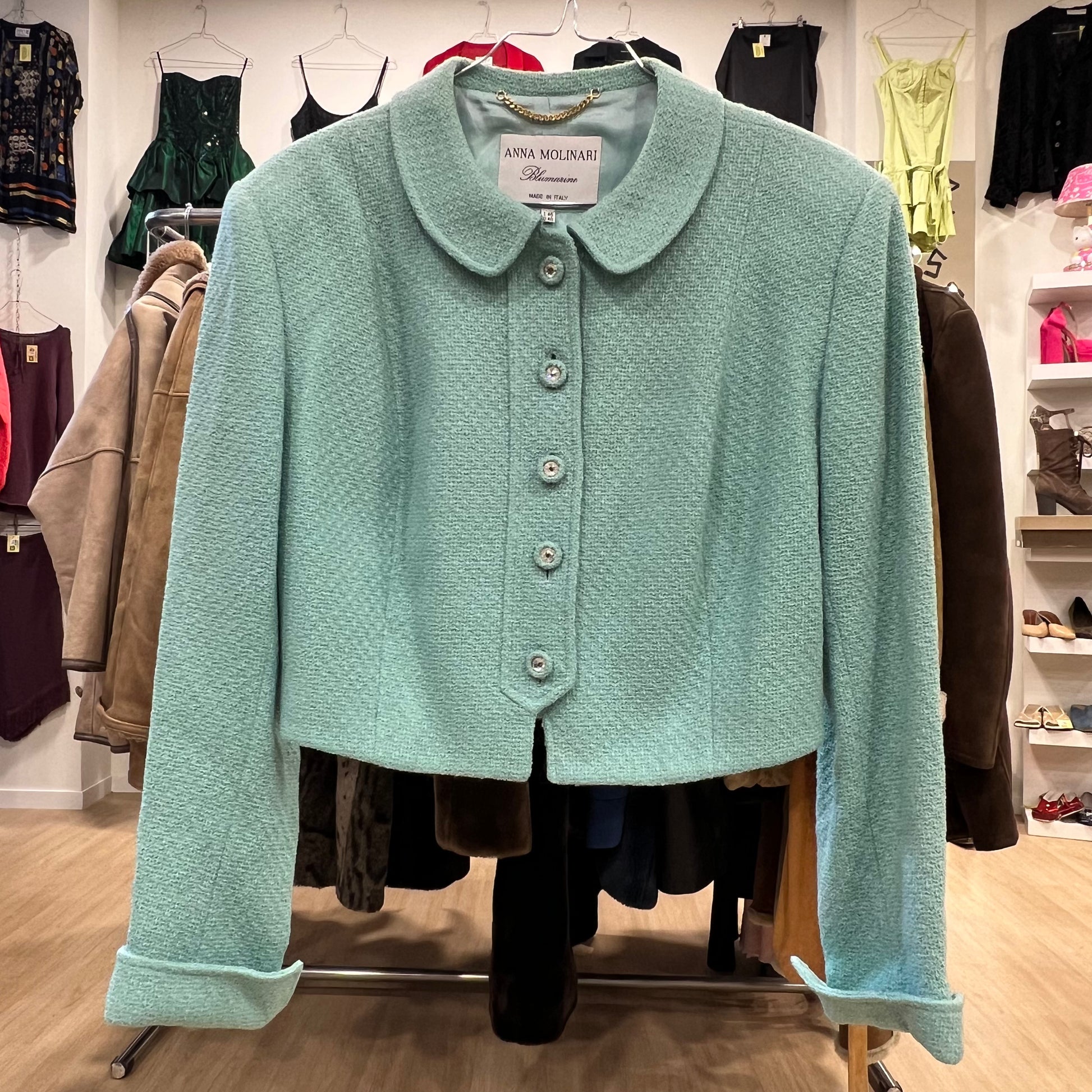 Light blue jacket on a rack in a clothing store