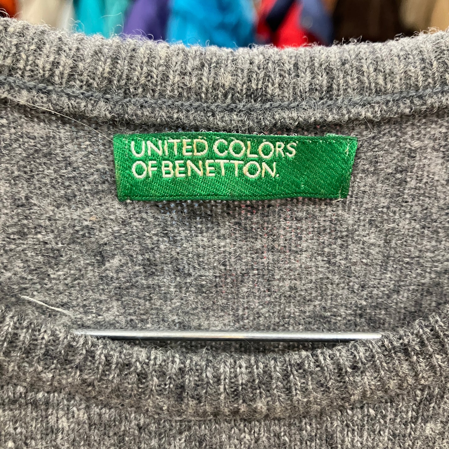 Gray fabric with a green 'United Colors of Benetton' label