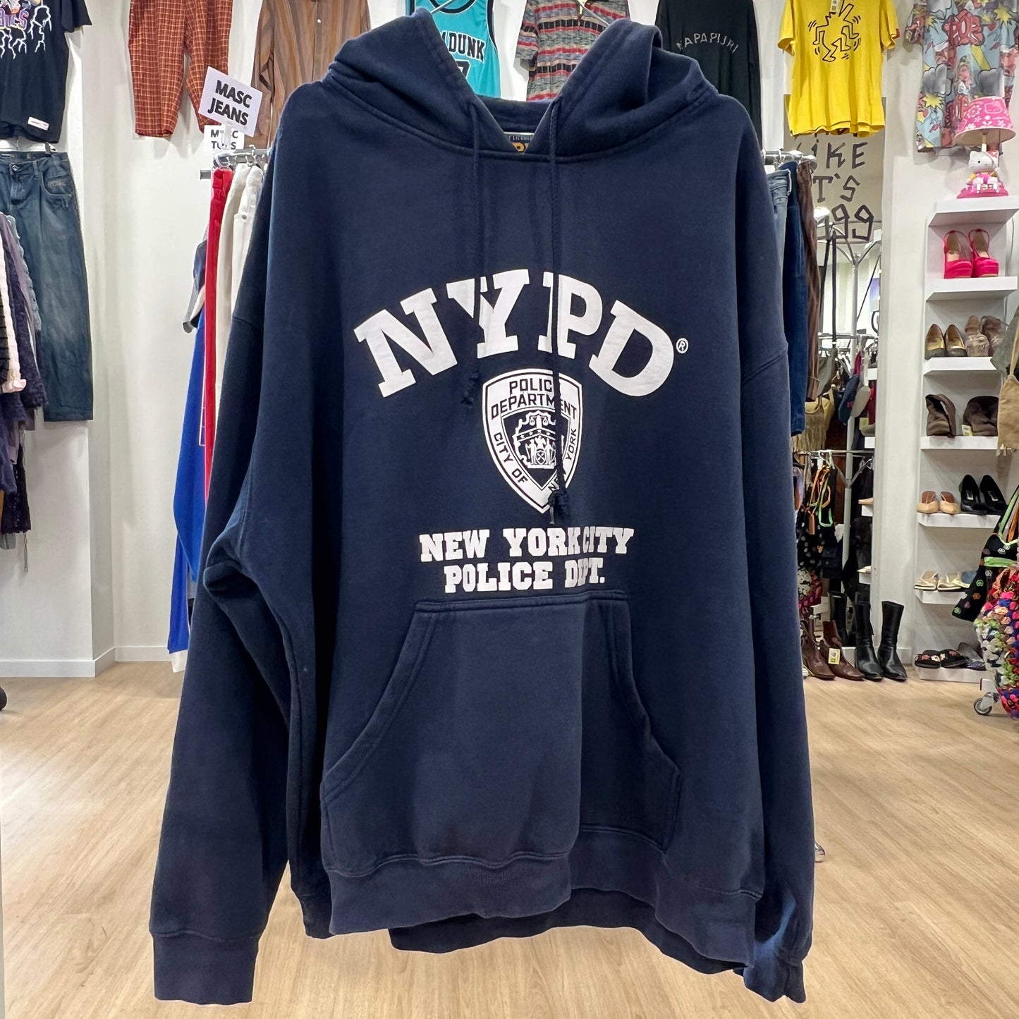NYPD hoodie displayed in a store setting