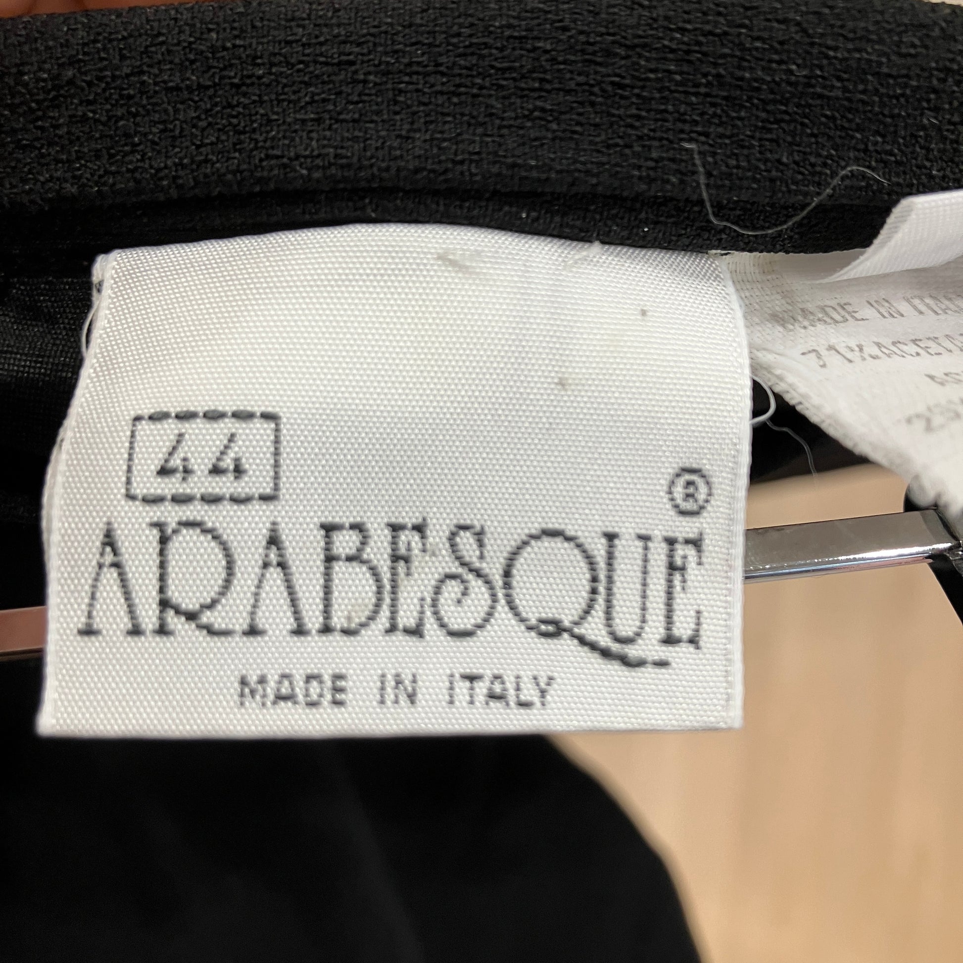 Arabesque label on a garment with 'Made in Italy' text