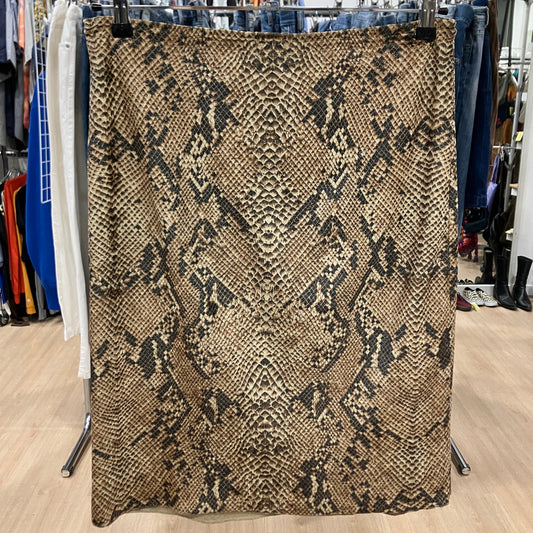 Textured fabric with a pattern draped over a rack in a store setting