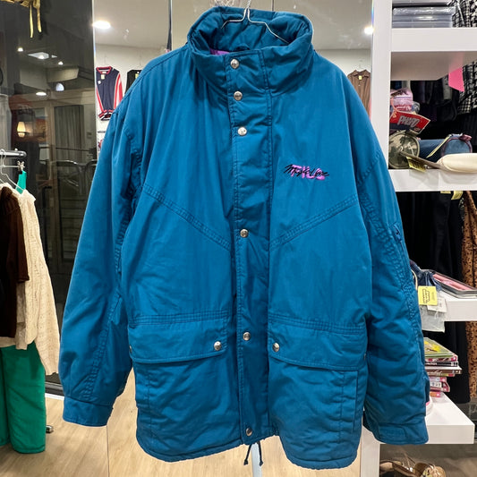 Blue jacket with a brand logo on a hanger in a store setting