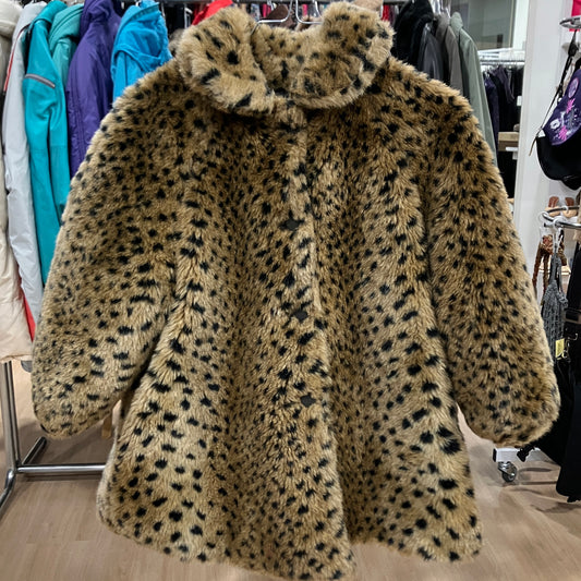 Leopard print fur coat in a store setting