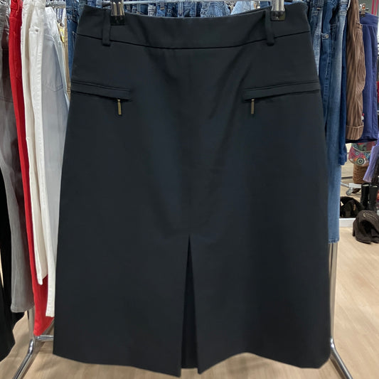 Black skirt on a rack with clothing in the background