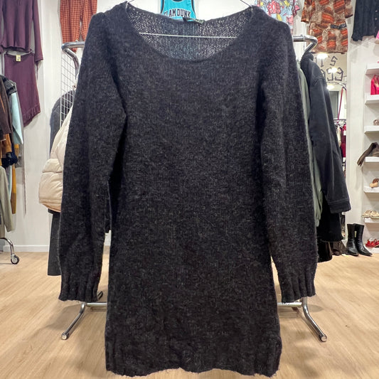 Dark gray sweater dress displayed in a store setting