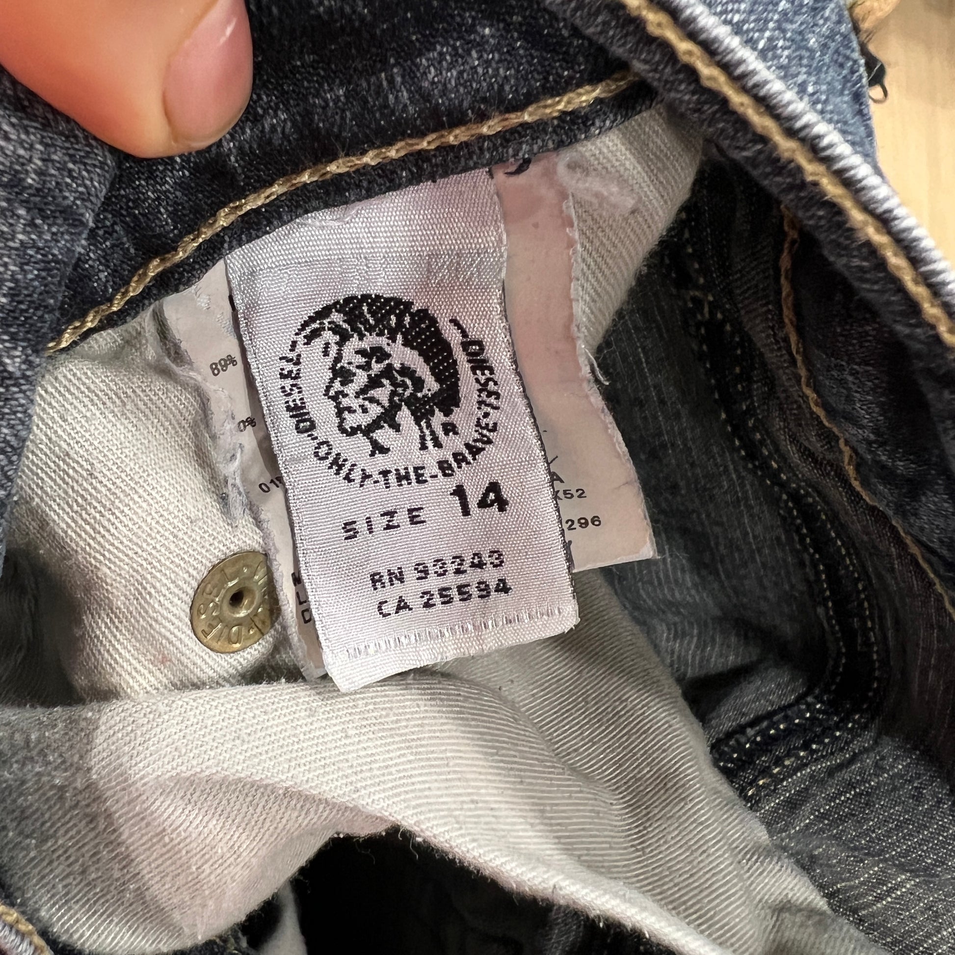 Close-up of a Diesel label on denim fabric