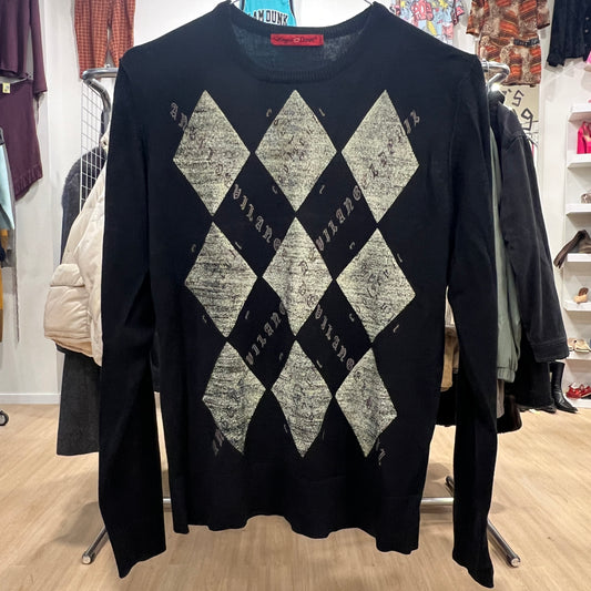 Black sweater with diamond pattern in a store setting