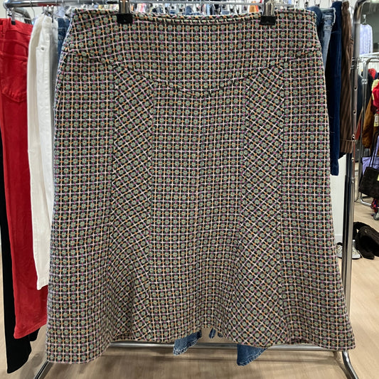 Patterned skirt on a clothing rack in a store setting