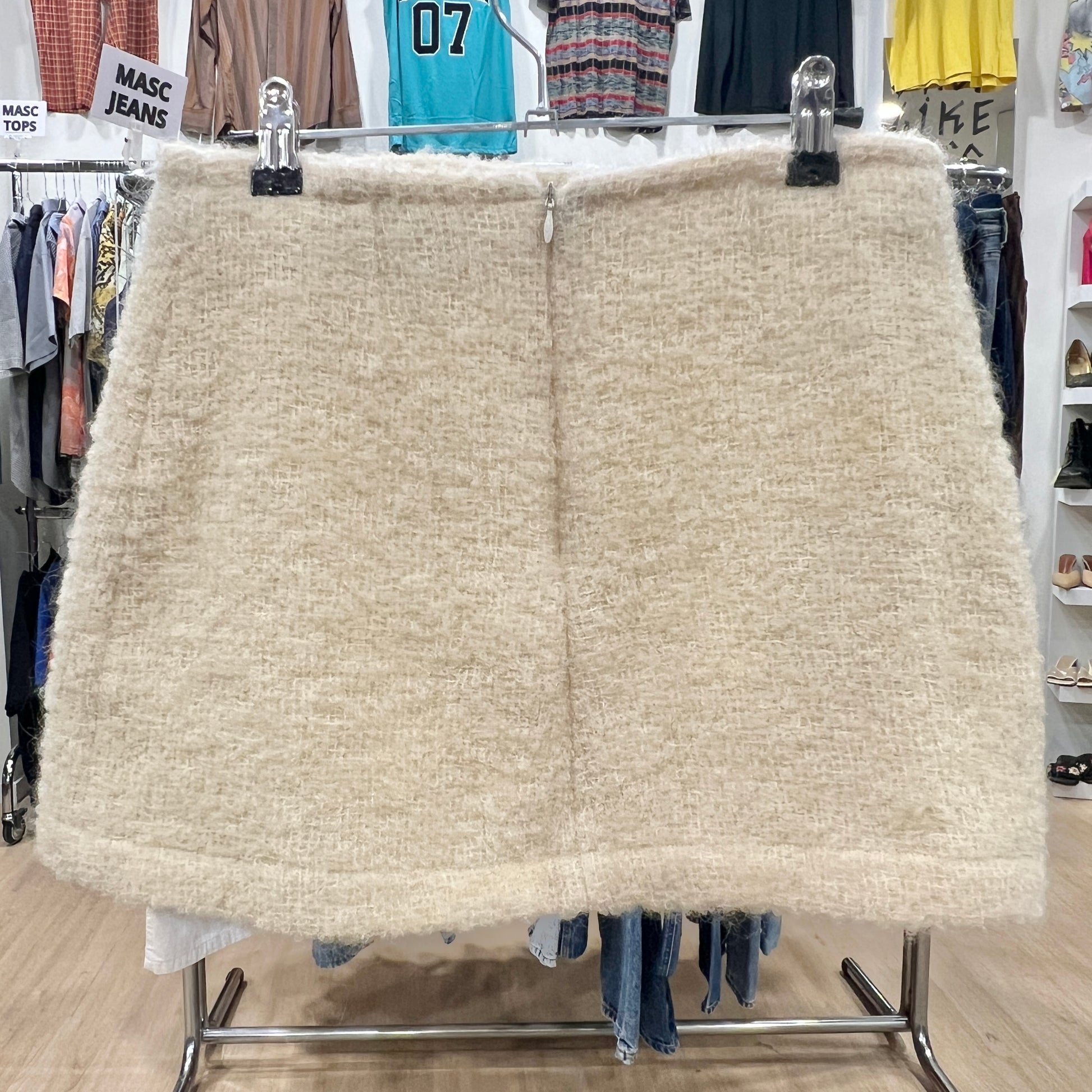 Beige skirt on a rack in a clothing store