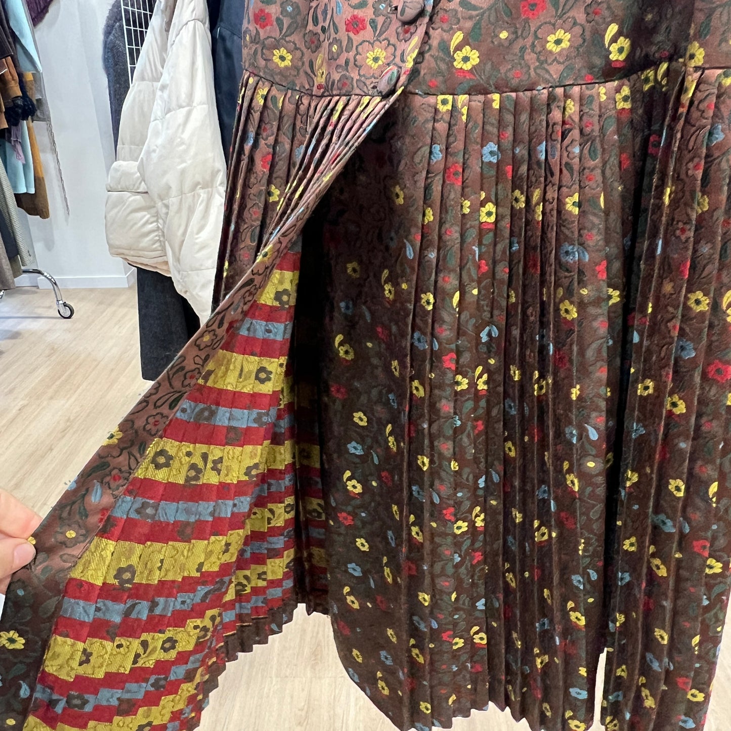 Patterned skirt with a colorful design on a wooden floor