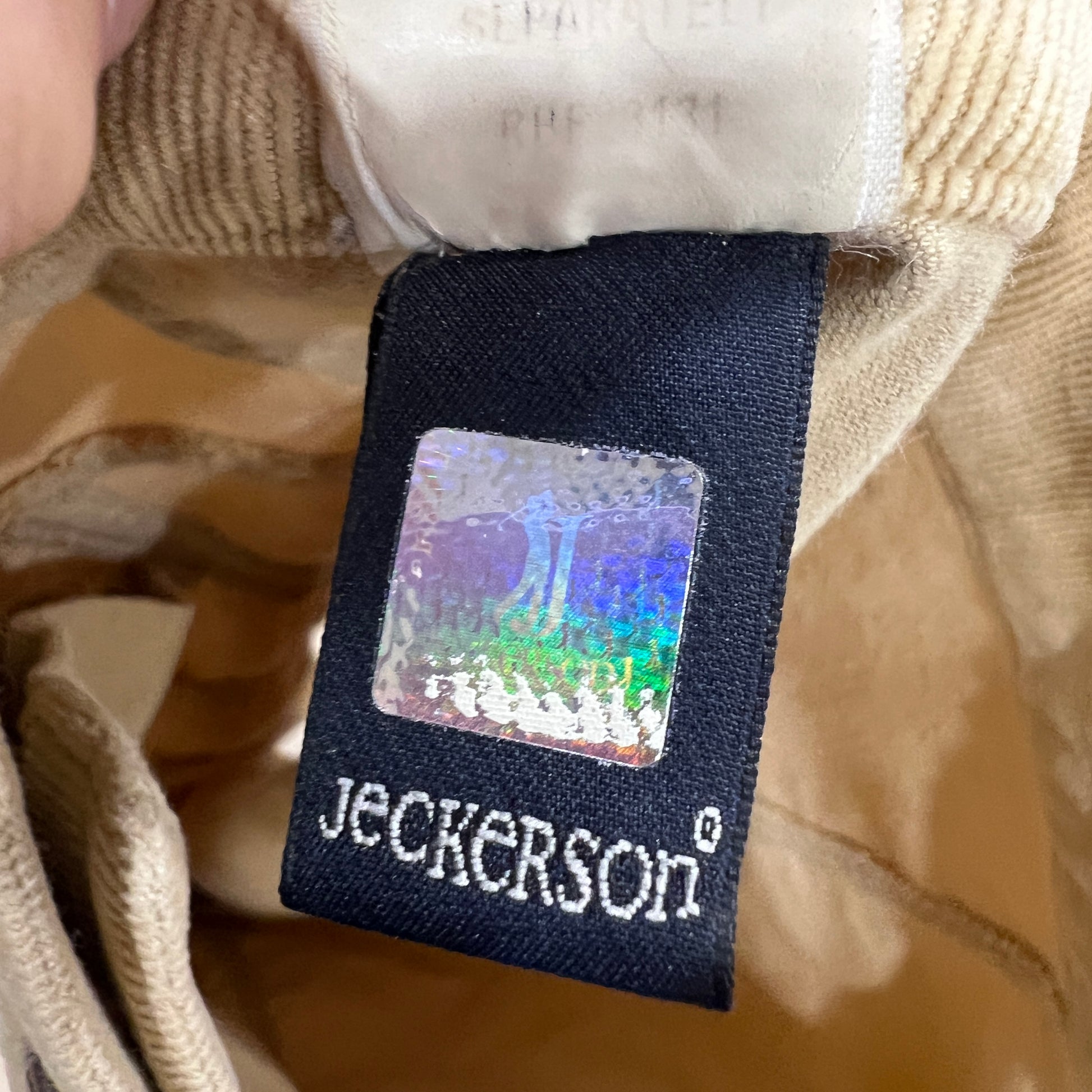 Jeckerson label on beige pants